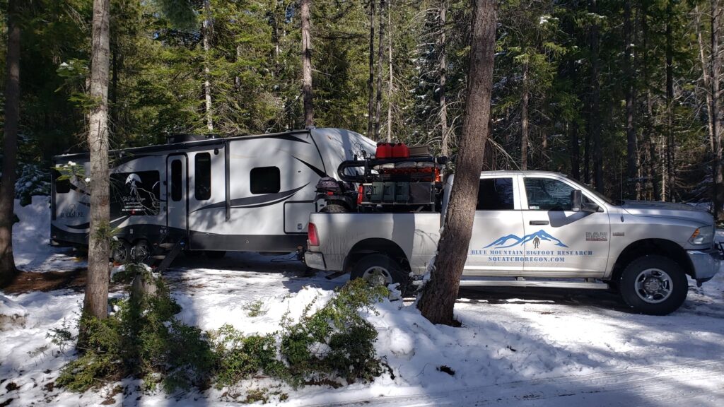 Our escape into the wild, where the journey From Stressed to Squatched began A truck and camper parked in a snowy forest, symbolizing the start of a journey to escape stress and reconnect with nature.